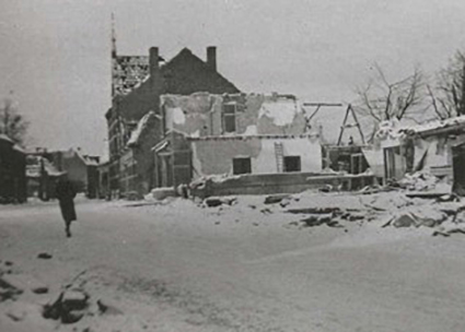Street and damaged building of Hotel De Keizer that was bombed during World War II.